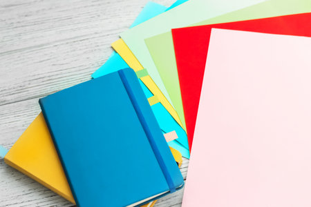 Notebook diary for planning in blue and yellow and colored cardboard for creativity.の写真素材