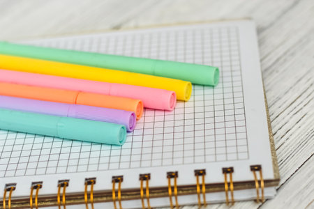 Notebook diary for planning and studying on the table with colored markers.の写真素材