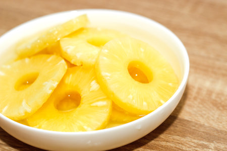 Pineapple rings canned in syrup close-up.の写真素材