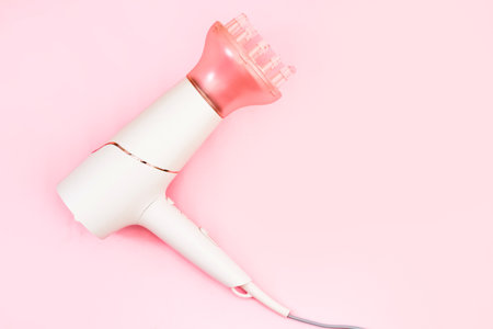 Professional hair dryer with a nozzle diffuser for curls.の写真素材