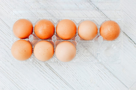 Store chicken eggs in a tray on kitchen boards
