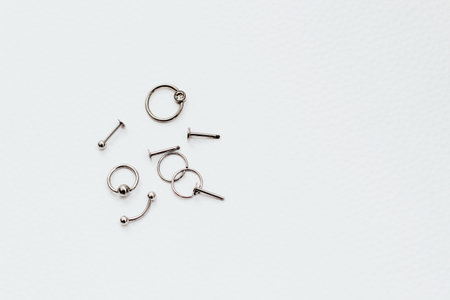 Earrings and rings made of medical steel for piercingの写真素材