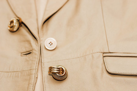 Decoration on the texture of a brown leather jacket, genuine soft leather.