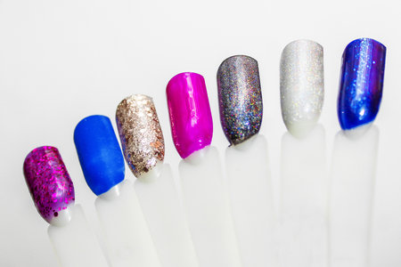 Palette of nail designs, testers of multicolored polishes on flat nailsの写真素材