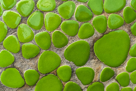 Green texture mosaic of ceramics of round shapeの写真素材