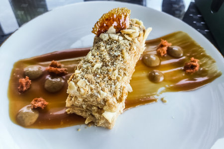 Napoleon cake dessert on a plate with caramelの写真素材