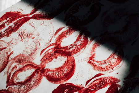Imprint of red lips on white paper, kiss backgroundの写真素材