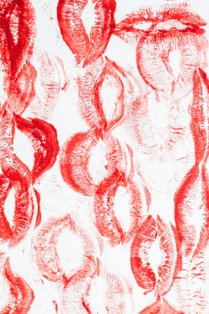 Imprint of red lips on white paper, kiss backgroundの写真素材