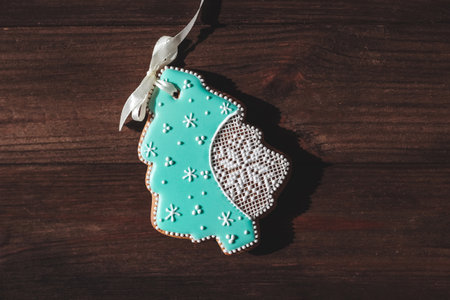 Homemade gingerbread in the shape of a Christmas tree with snowflakesの写真素材