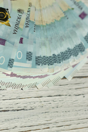 Banknote of 1000 Ukrainian hryvnias on a wooden background