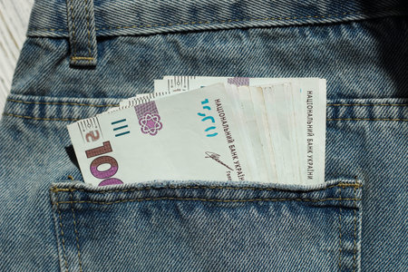 Banknote of 1000 Ukrainian hryvnias on a denim background in a pocket