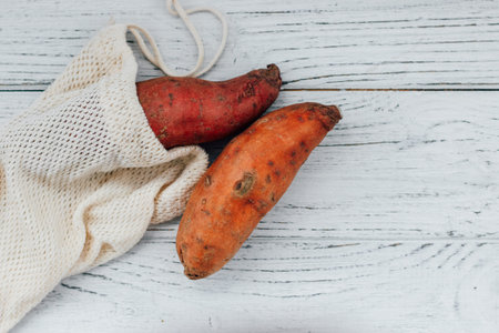 Sweet potato potato vegetable on a wooden table