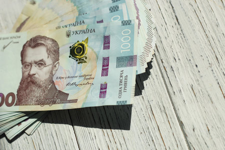 Banknote of 1000 Ukrainian hryvnias on a wooden backgroundの写真素材