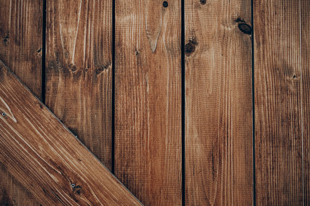 This setting features a close-up view of wooden planks showcasing their natural grain patterns and warm tones.の写真素材