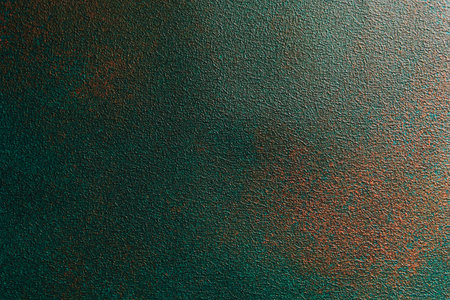 Surface features an intriguing blend of teal and copper colors showcasing a unique textured pattern perfect for various creative uses.の写真素材