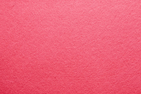 A bright pink textured material displays a soft fabric surface ideal for creative art projects or craft activities.の写真素材