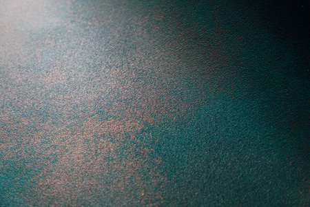 Close up view of a textured surface highlighting rich colors and intricate patterns creating an...