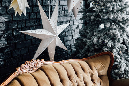Soft neutral tones blend with festive star decorations in a cozy winter living room featuring a...
