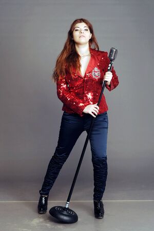 singer, concert, microphone to sing, vocal, vocalist, girl sings, fate the singer, fate, music, rock music, scene, singer on a scene, disco, disco music, sound, voice to sing in the microphoneの写真素材