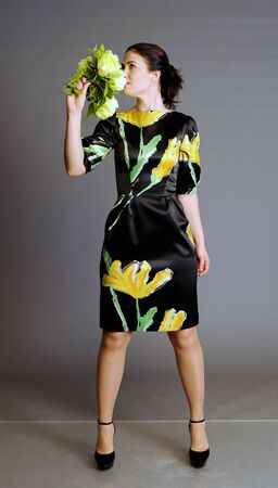 summer dress, dress in a floret, girl with flowers, bouquet, beautiful bouquet in hands at the girlの写真素材