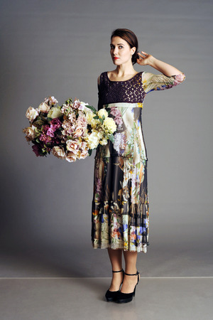 woman with a bouquet, big bouquet, coat, fashionable coat, bright coat, autumn women's coat, women's coat, light overcoatの写真素材