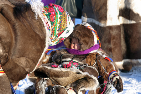 Nadym, Russia - March 02, 2014: Family of Nenets on a traditional holiday "Day of the reindeer breeder". Nenets - the indigenous small people of the Russian Northのeditorial素材