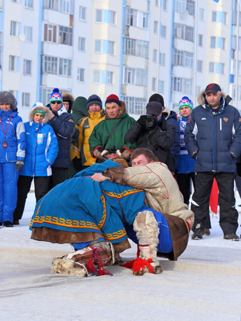 NADYM, RUSSIA - MARCH 14, 2015: National Nenets fight competitions on a traditional holiday "Day of the reindeer breeder. Nenets - aboriginals of the Russian Northのeditorial素材