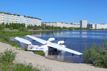NADYM, RUSSIA - JUNE 22, 2016: The Russian  L-42m RA-1948G hydroplane on the bank of a city pondのeditorial素材