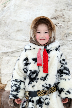 NADYM, RUSSIA - MARCH 05, 2017: Boy reindeer breeder Nenets in national clothes on a traditional holiday "Day of the reindeer breeder". Nenets - aboriginals of the Russian Northのeditorial素材