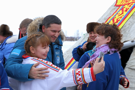 NADYM, RUSSIA - MARCH 04, 2017: The Governor of Yamal Dmitry Kobylkin and the woman Nenets reindeer herder takes selfies on a traditional holiday "Day of the reindeer breeder"のeditorial素材