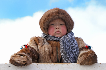 NADYM, RUSSIA - MARCH 05, 2017: Boy reindeer breeder Nenets in national clothes on a traditional holiday "Day of the reindeer breeder". Nenets - aboriginals of the Russian Northのeditorial素材