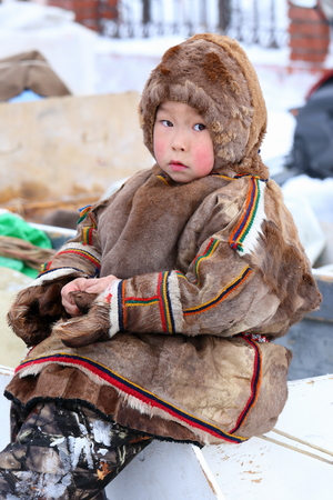 NADYM, RUSSIA - MARCH 05, 2017: Boy reindeer breeder Nenets in national clothes on a traditional holiday "Day of the reindeer breeder". Nenets - aboriginals of the Russian Northのeditorial素材