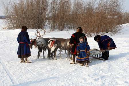 NADYM, RUSSIA-MARCH 07, 2010: Nenets family in national fur clothes. Nenets - aboriginals of the Russian Northのeditorial素材