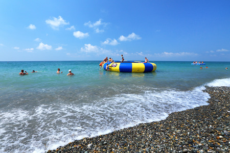 Sochi, RUSSIA-AUGUST 10, 2013: Child plays on the Black sea coastのeditorial素材