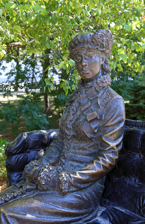 Novorossiysk, RUSSIA-AUGUST 10, 2015: Sculpture of a girl in a carriage in the Park in summerのeditorial素材