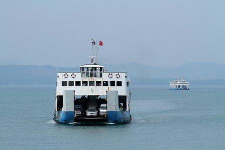 PATTAYA, THAILAND-MARCH 30, 2012: sea ferry with cars sailing on the tropical seaのeditorial素材