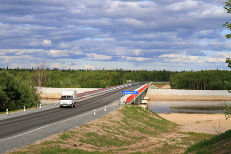 NADYM, RUSSIA-JULY 06, 2011: Bridge over the Right Hetta river in Yamalo-Nenets district of Russia. Federal highway Surgut-Salekhardのeditorial素材