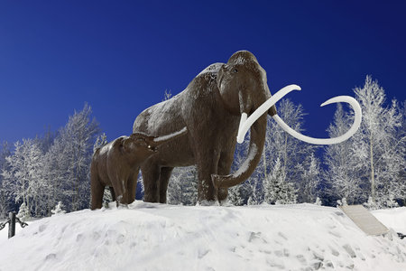 NADYM, RUSSIA-JANUARY 24, 2022: Sculptural composition of a mammoth and a baby mammoth in winter in...