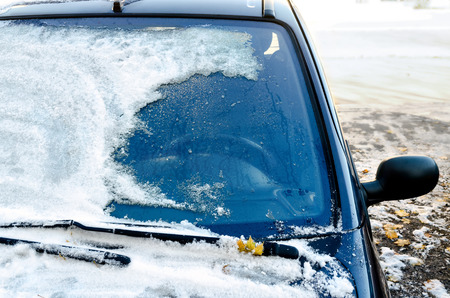 Close-up of snow-covered car windscreenの写真素材