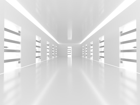 Illuminated long corridor in modern office buildingの写真素材