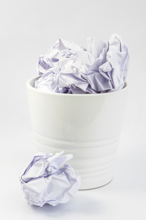 Paper cube in the bucket white isolated backgroundの写真素材