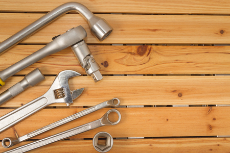 Set of tools over a wood panel with spaceの写真素材