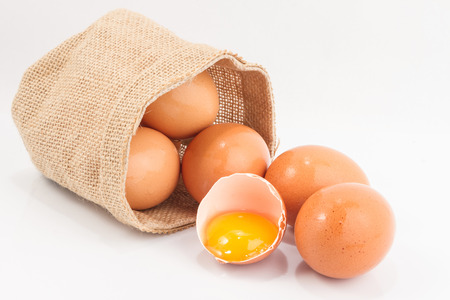 Eggs in a small sack isolated on white backgroundの写真素材