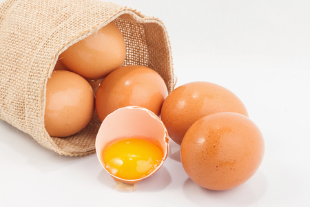 Eggs in a small sack isolated on white backgroundの写真素材