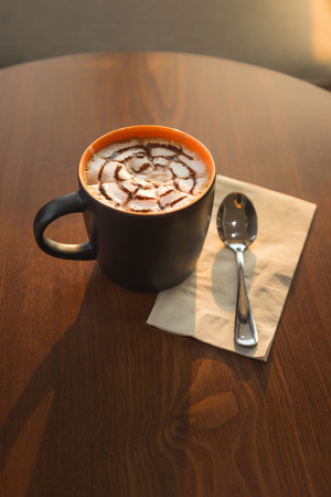 Espresso coffee on warm light wooden tableの写真素材