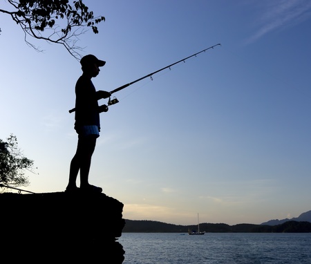 silhouette man fishingの写真素材