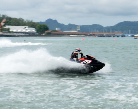 LANGKAWI, MALAYSIA - APRIL 13 : Unidentified rider pumps up his machine during Langkawi International Formula Jet Ski Super Series, April 13, 2012 in Langkawi, Malaysia.のeditorial素材