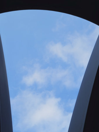 blue sky and clouds as seen through the window of a modern buildingの写真素材
