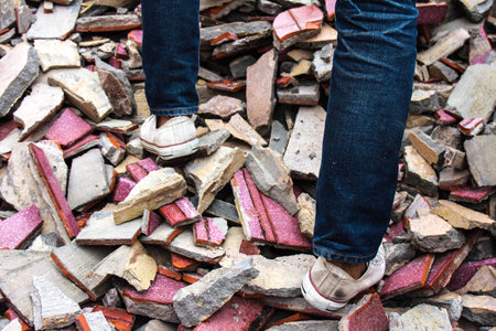 Old sneakers on the floor bricksの写真素材