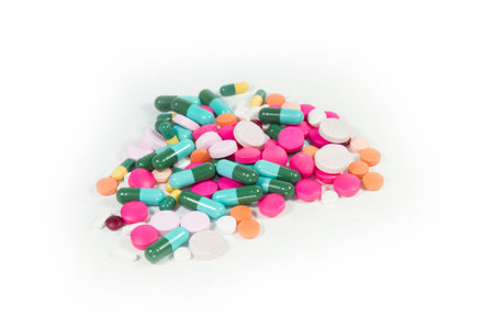 Stack of different pills on white backgroundの写真素材